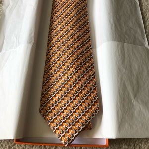 Hermès Brown and Orange 100% silk tie.